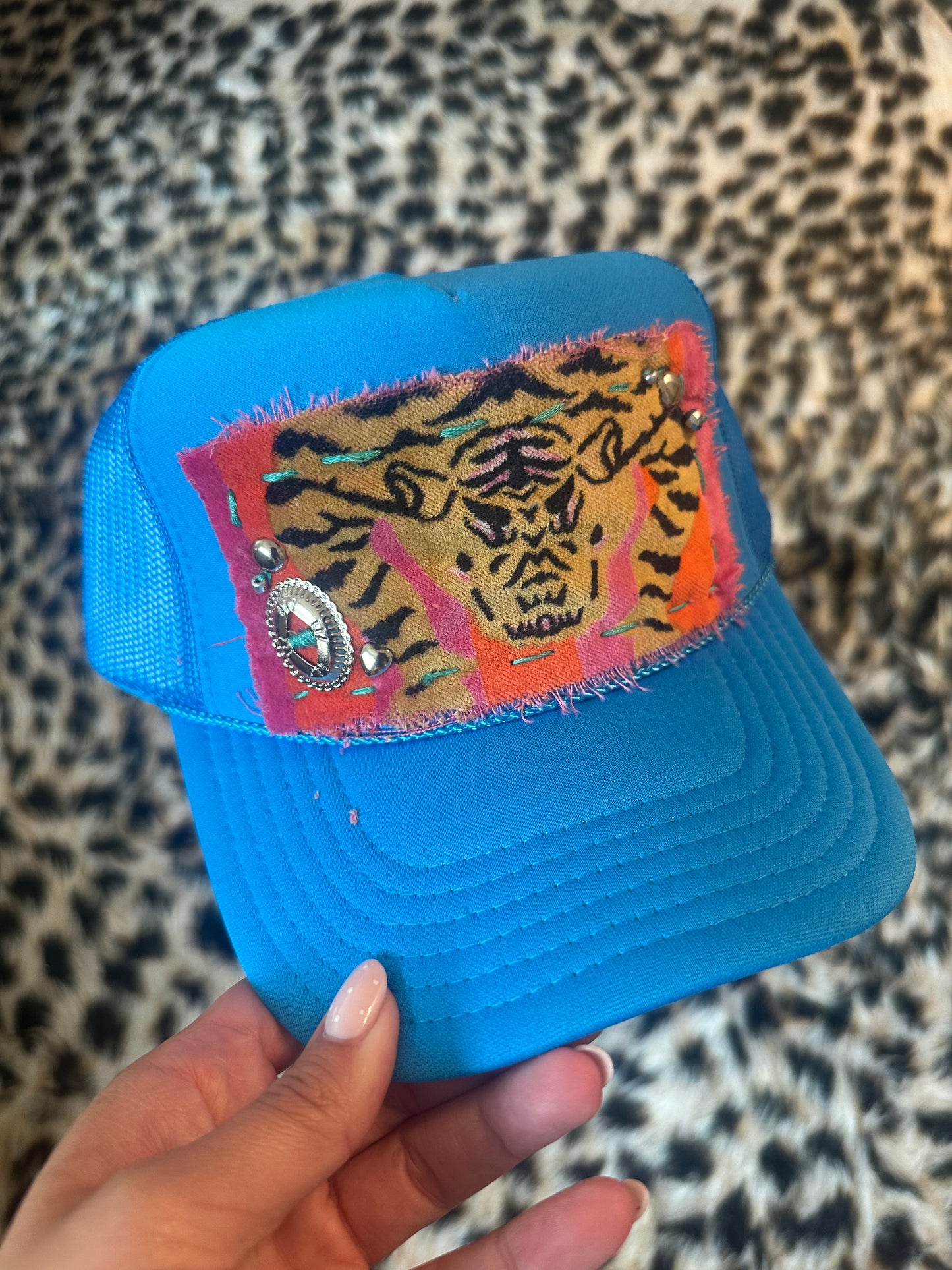 Tiger by the tail trucker hat